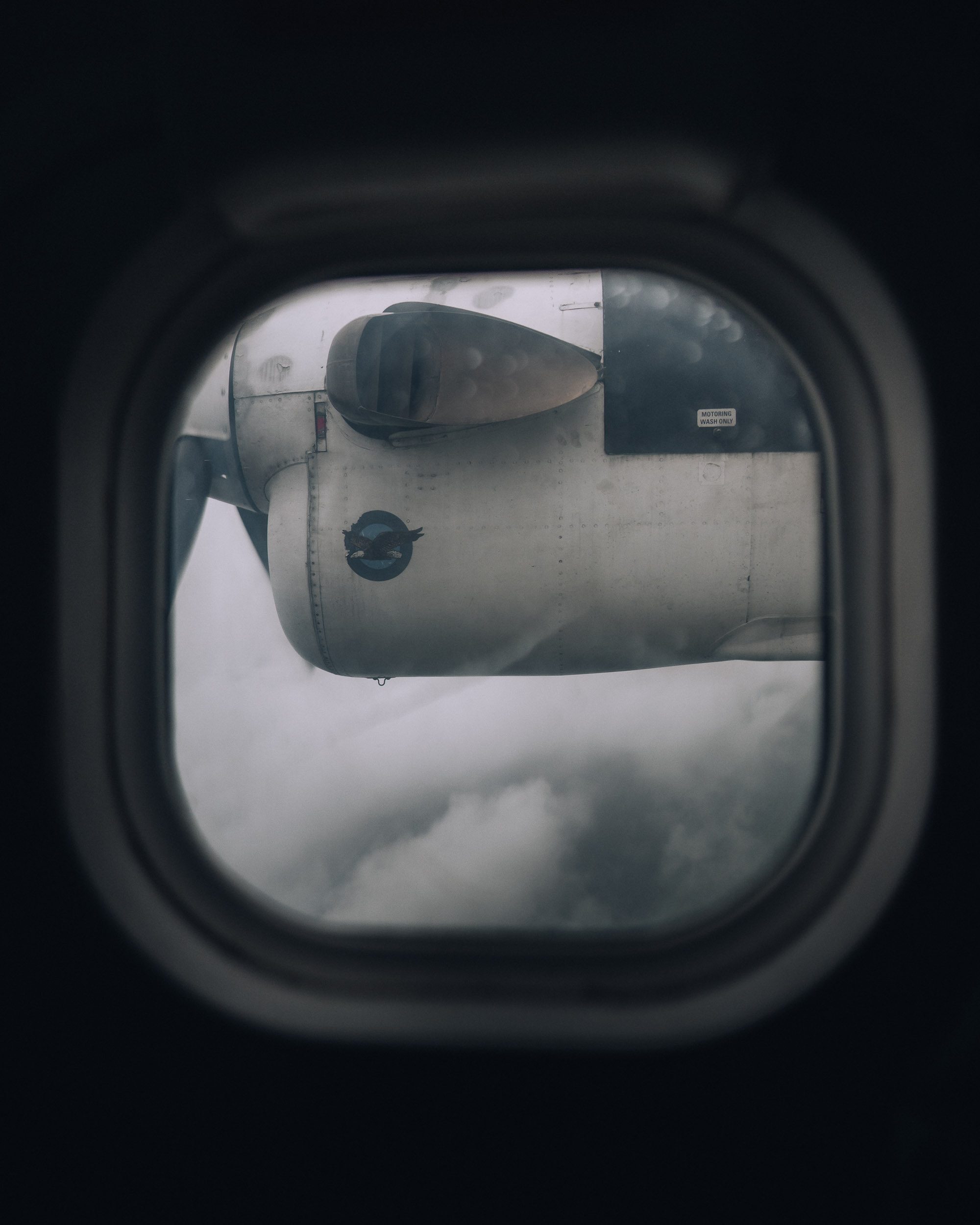 Cloudy window view from plane journey to Lukla