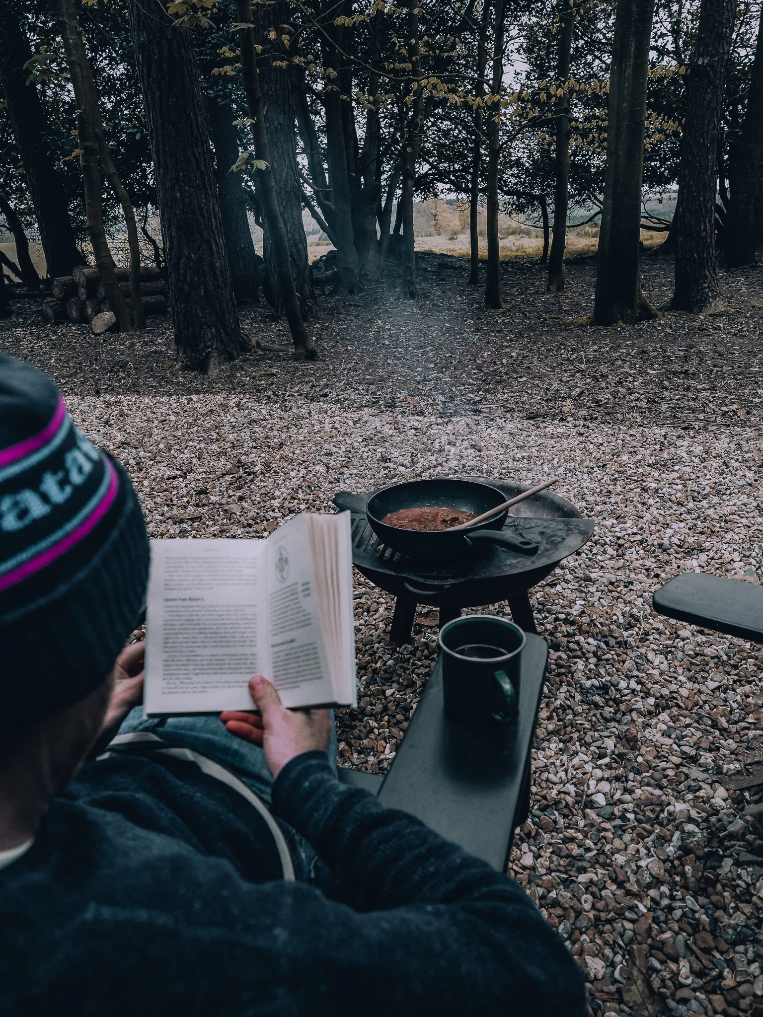 Relaxing outside the Unplugged Mabel cabin with a book, coffee and food