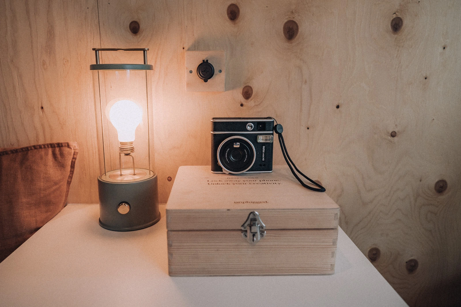 Phone lockbox, camera and lamp inside the Unplugged Mabel cabin