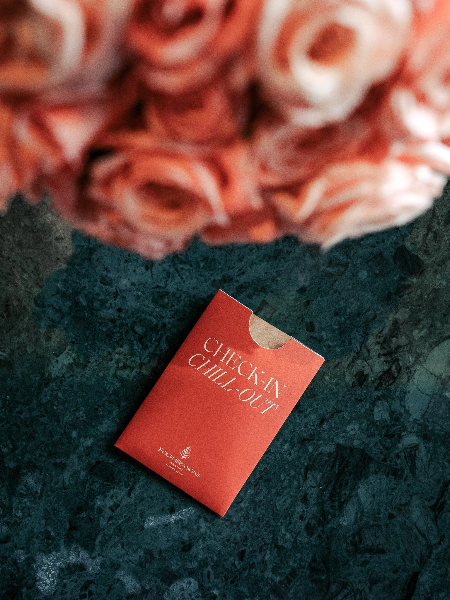 Four Seasons Marrakech check-in card with roses