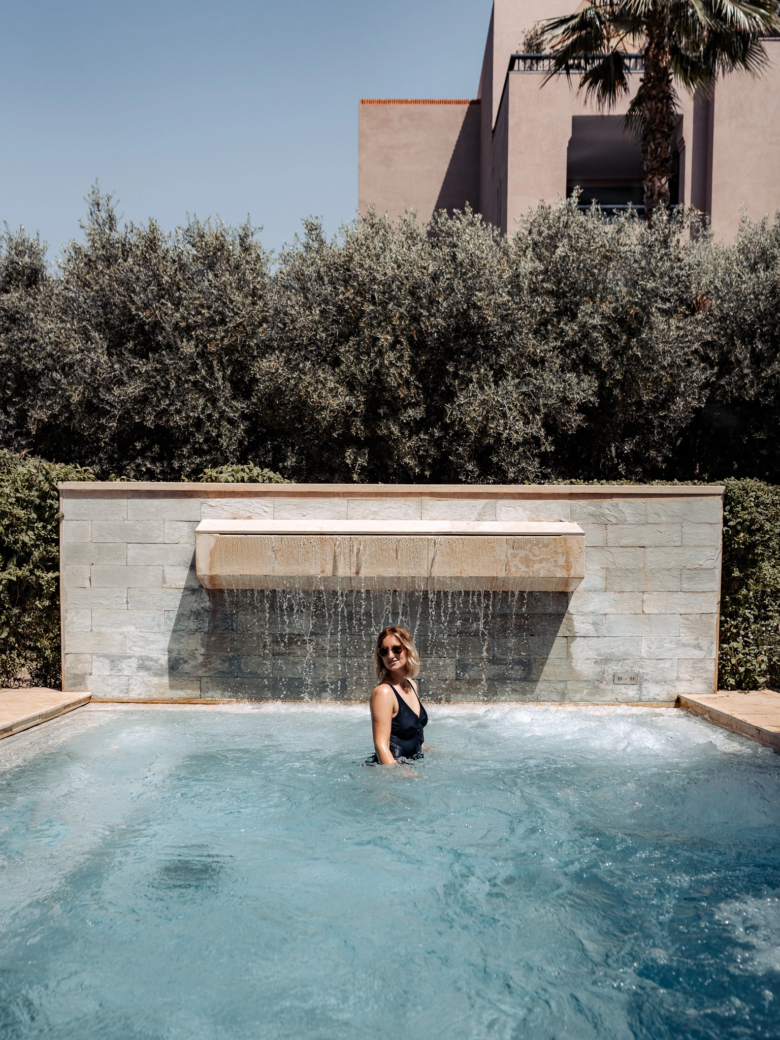 Female relaxing in the pool area at Four Seasons Marrakech