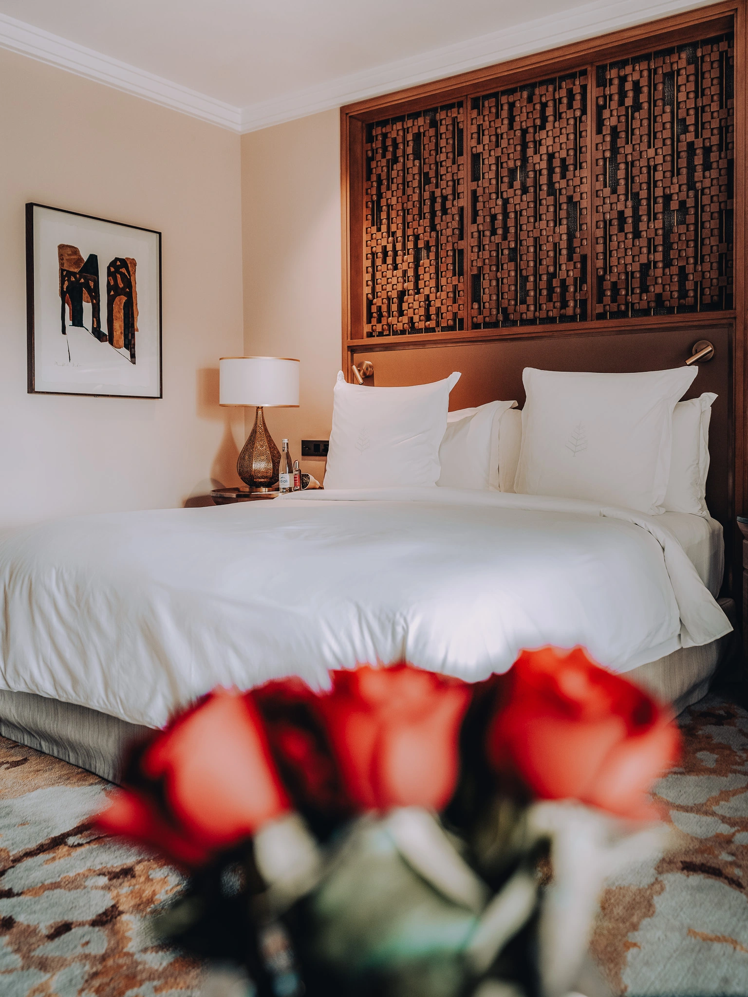 Bedroom setting with roses in the foreground at Four Seasons