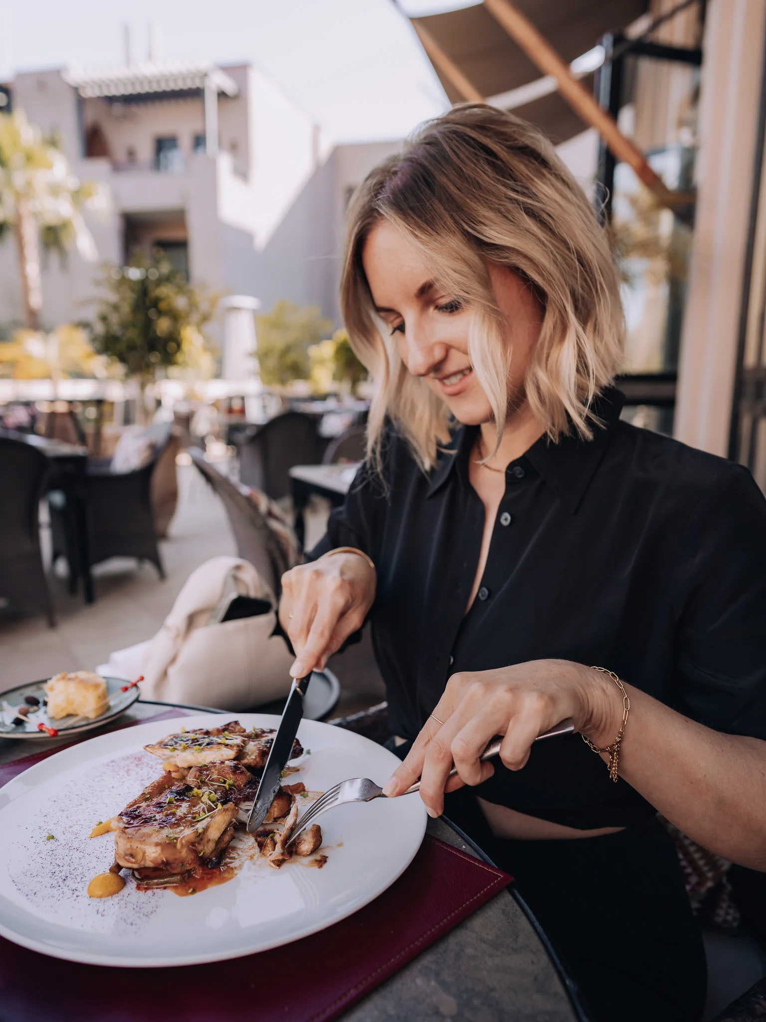 female enjoying dinner at Inara restaurant Four Seasons Marrakech