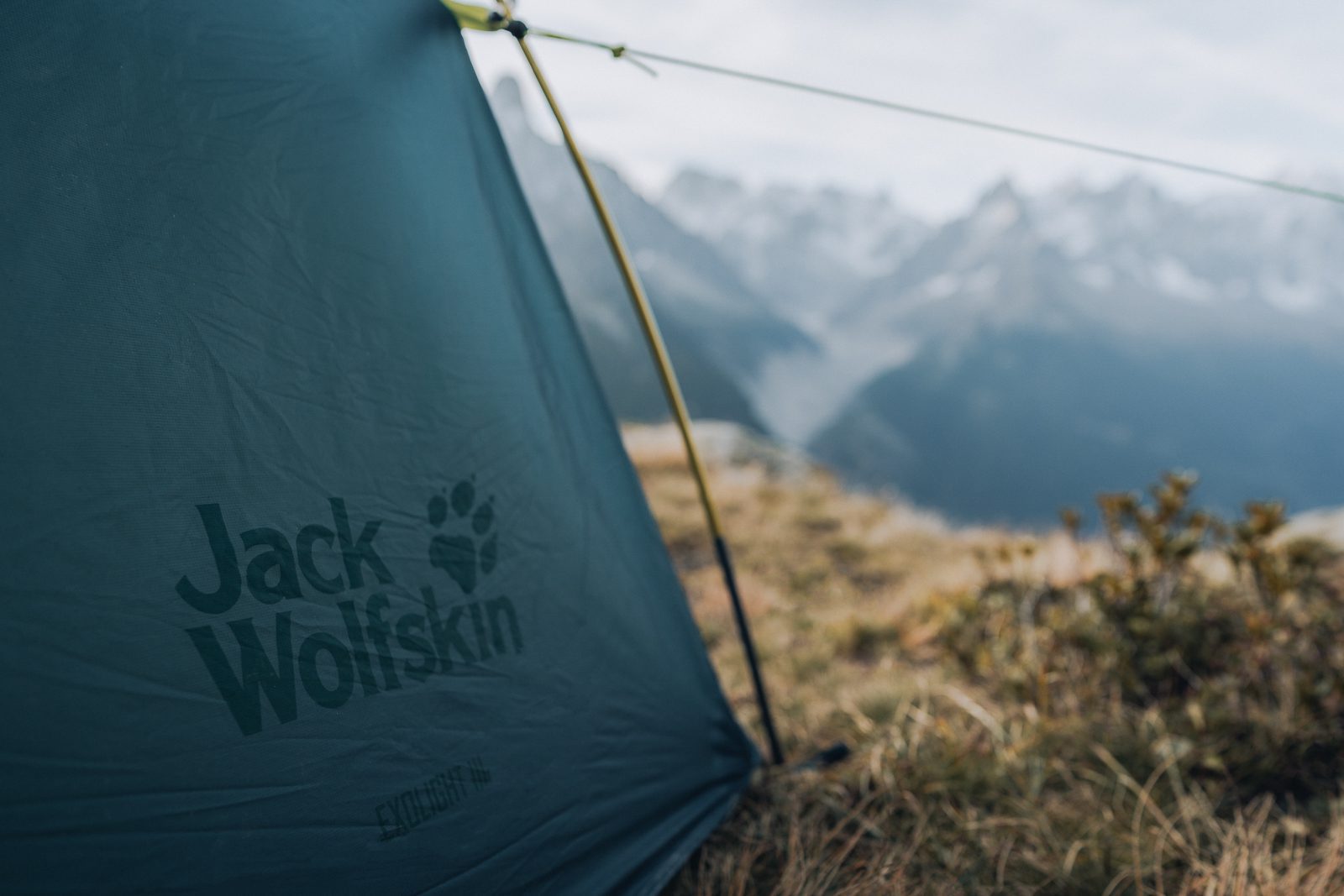 A Jack Wolfskin tent perched on a mountain top.
