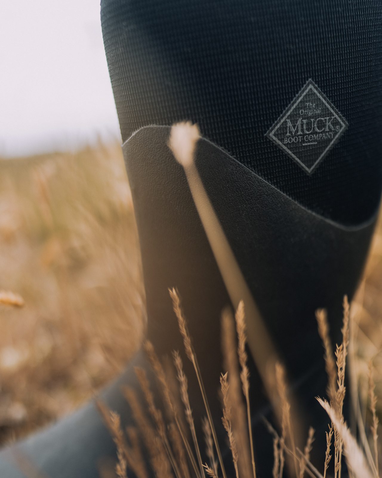 Muck Boot in tall grass