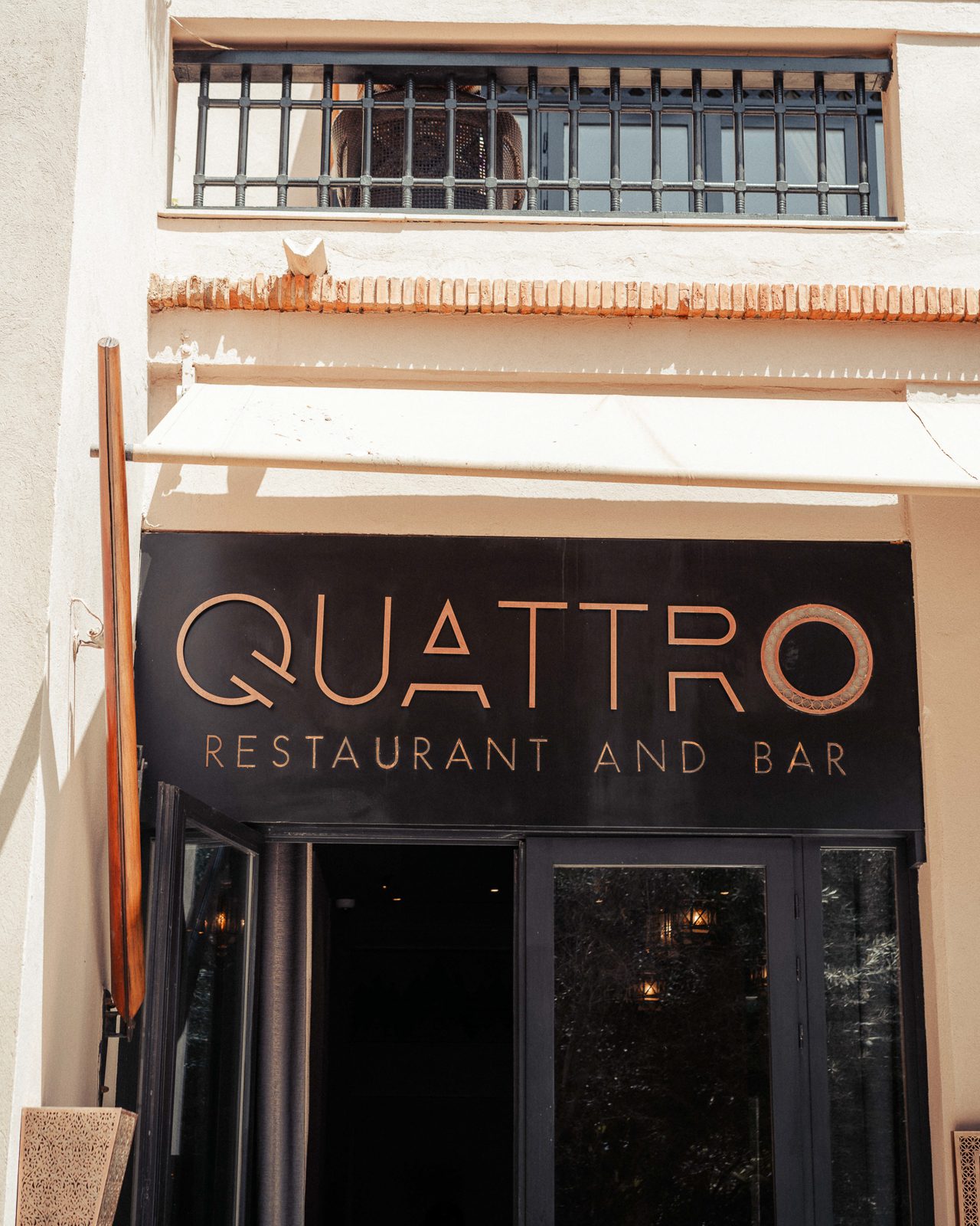Elegant restaurant sign with modern design.
