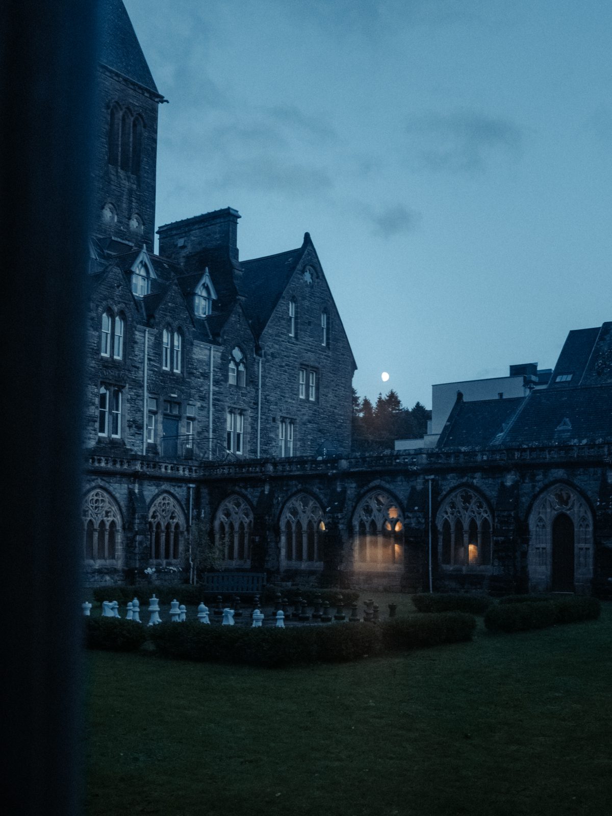 Historic building with moonlit courtyard.