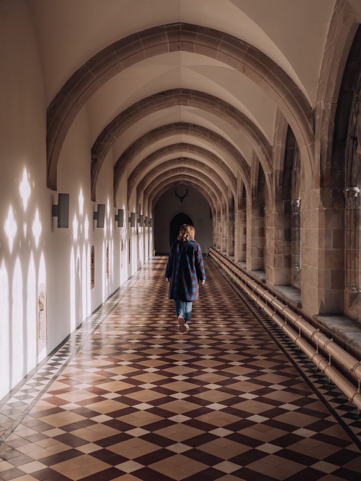 female walking in corridor of highland club