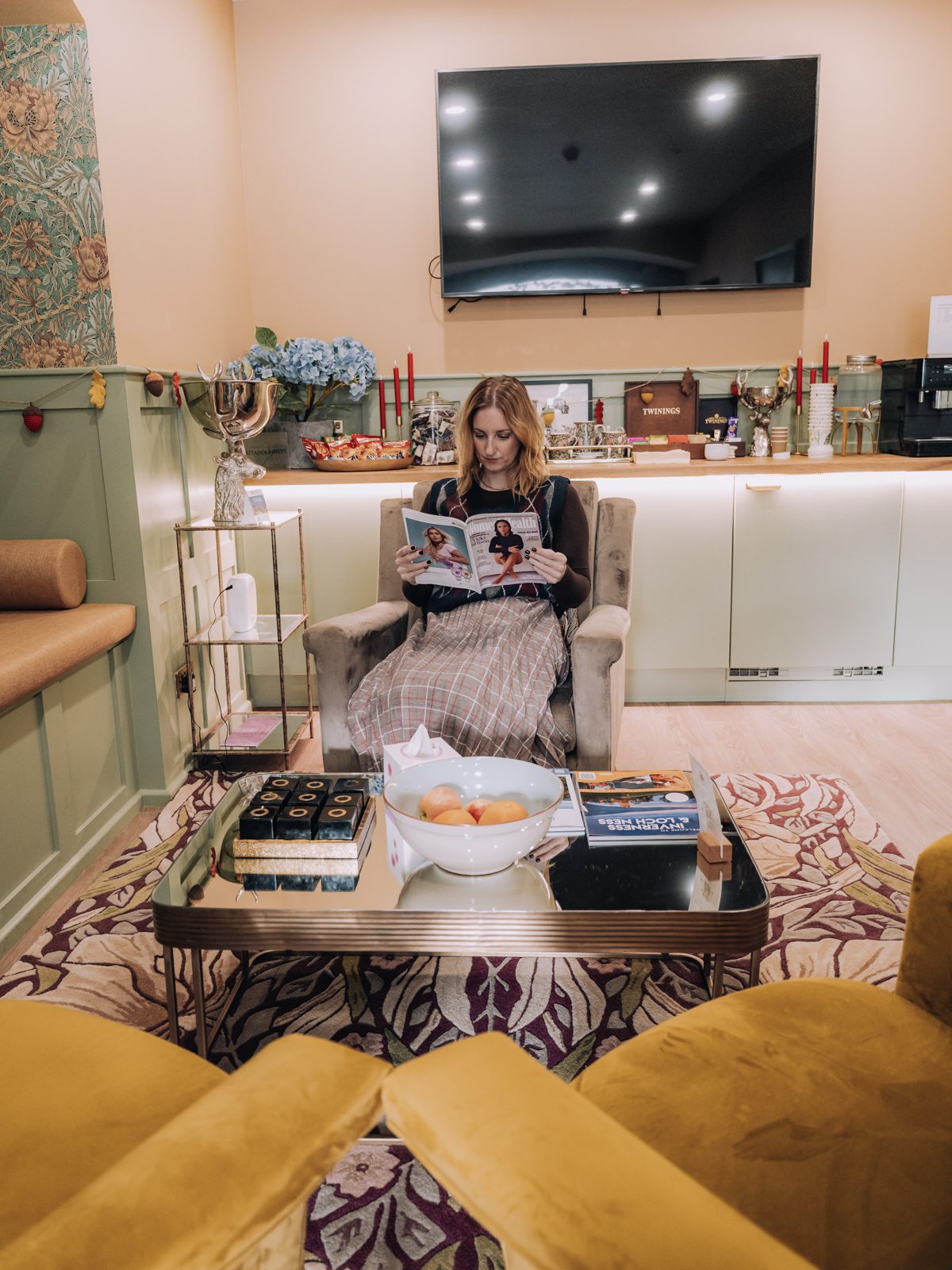 Woman reading in a stylish lounge.