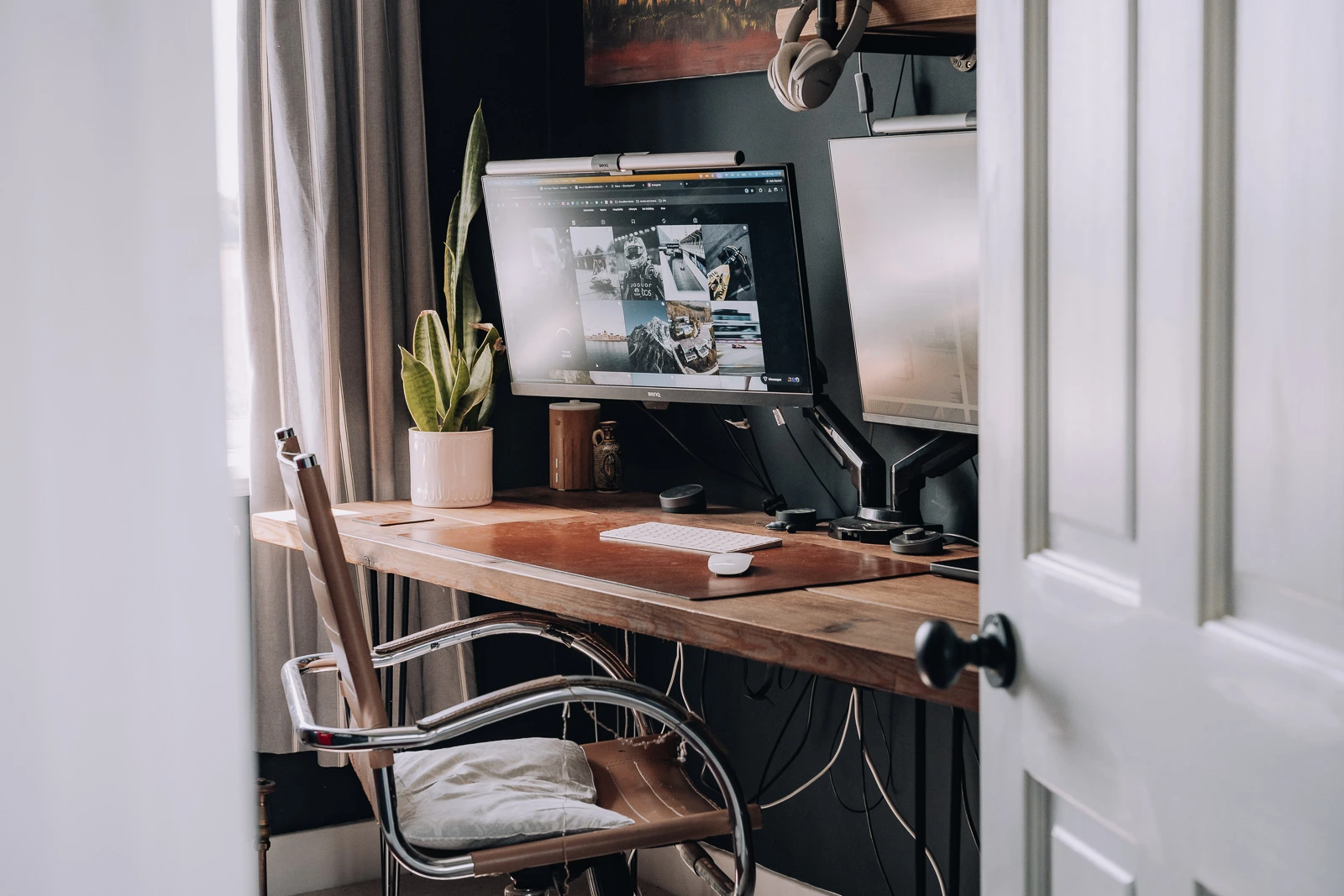 office set up with BenQ monitor and MacBook Pro editing setup for professional travel photography.