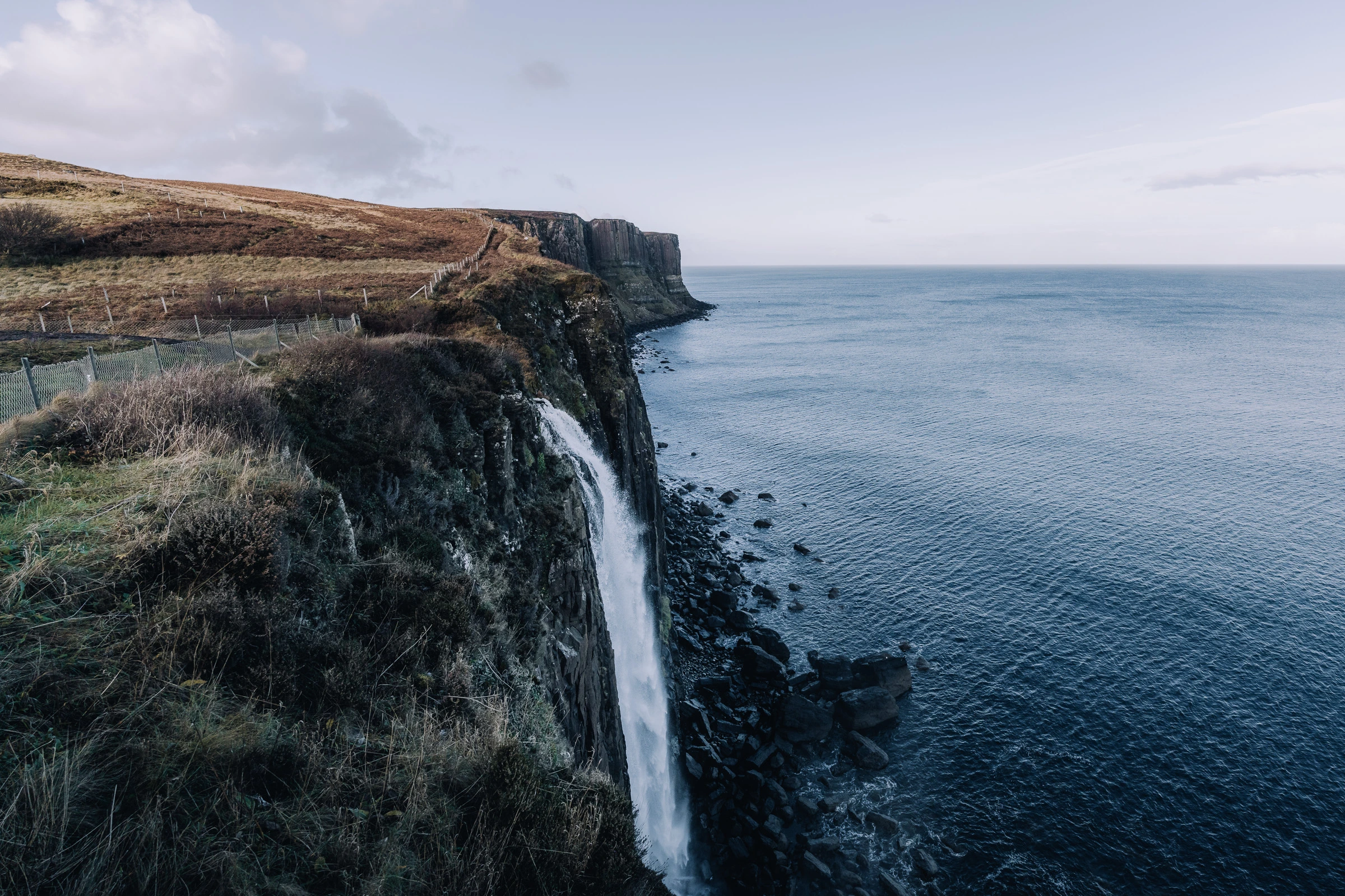 Mealt Falls cascading from Kilt Rock into the sea on the Isle of Skye