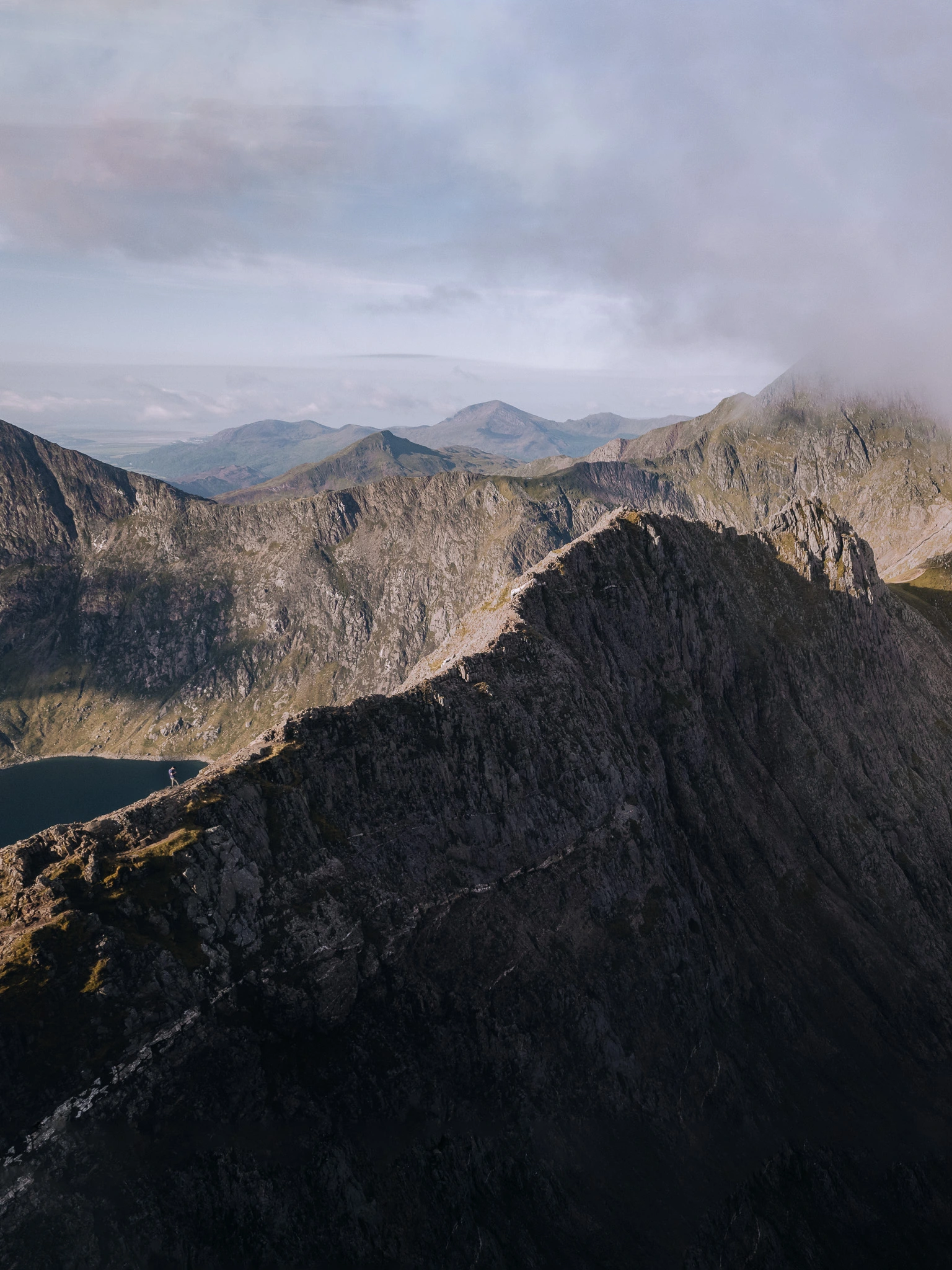 Dramatic mountain landscape in Wales, drone photo with scale of small person