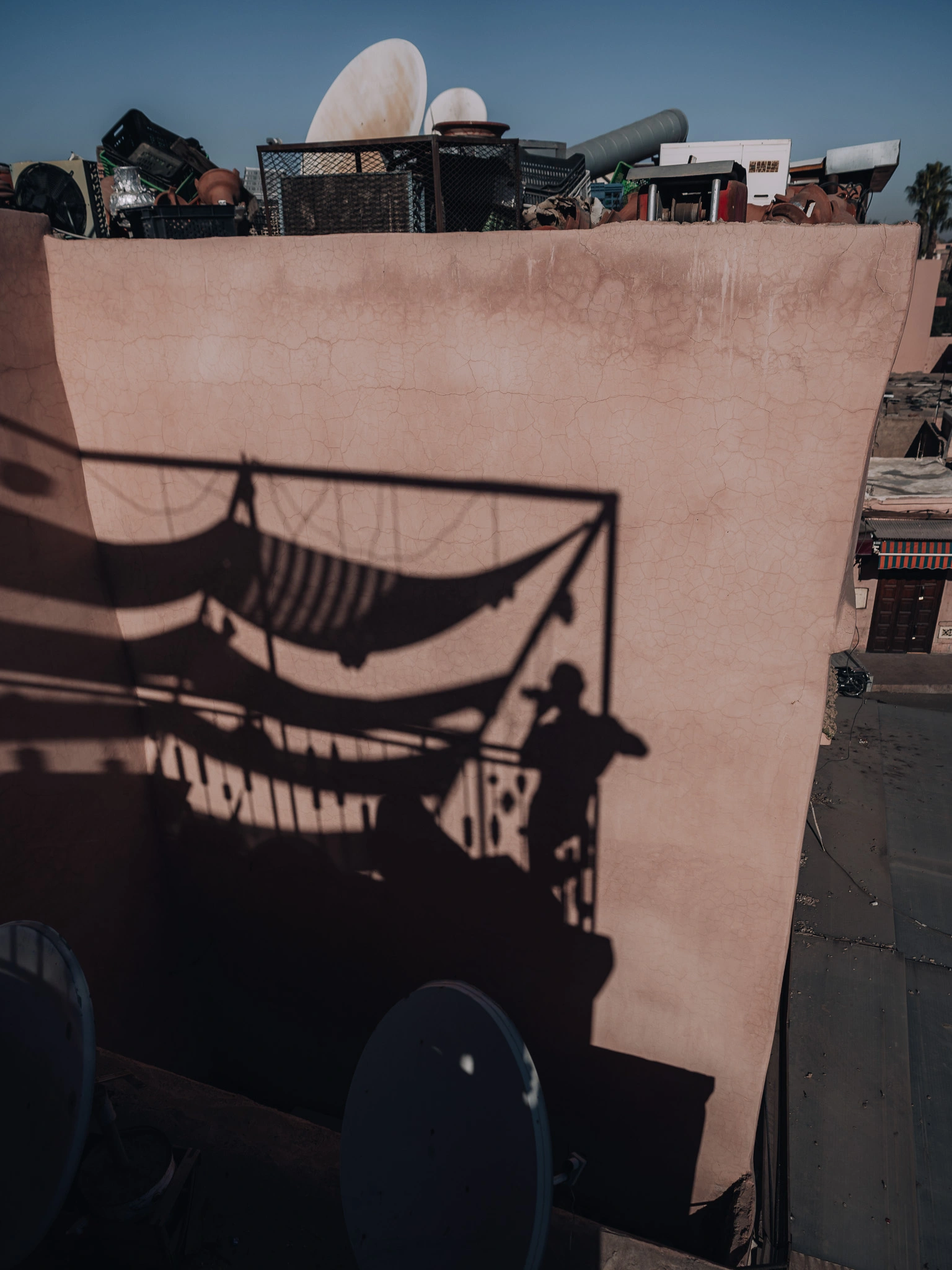 Shadow of Pete enjoying a drink on a rooftop in Marrakech, Morocco