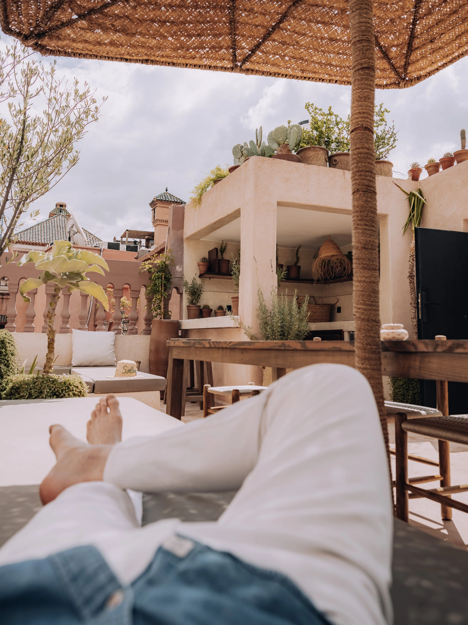 Guest relaxing in the peaceful rooftop courtyard at Riad Solange in Marrakech.