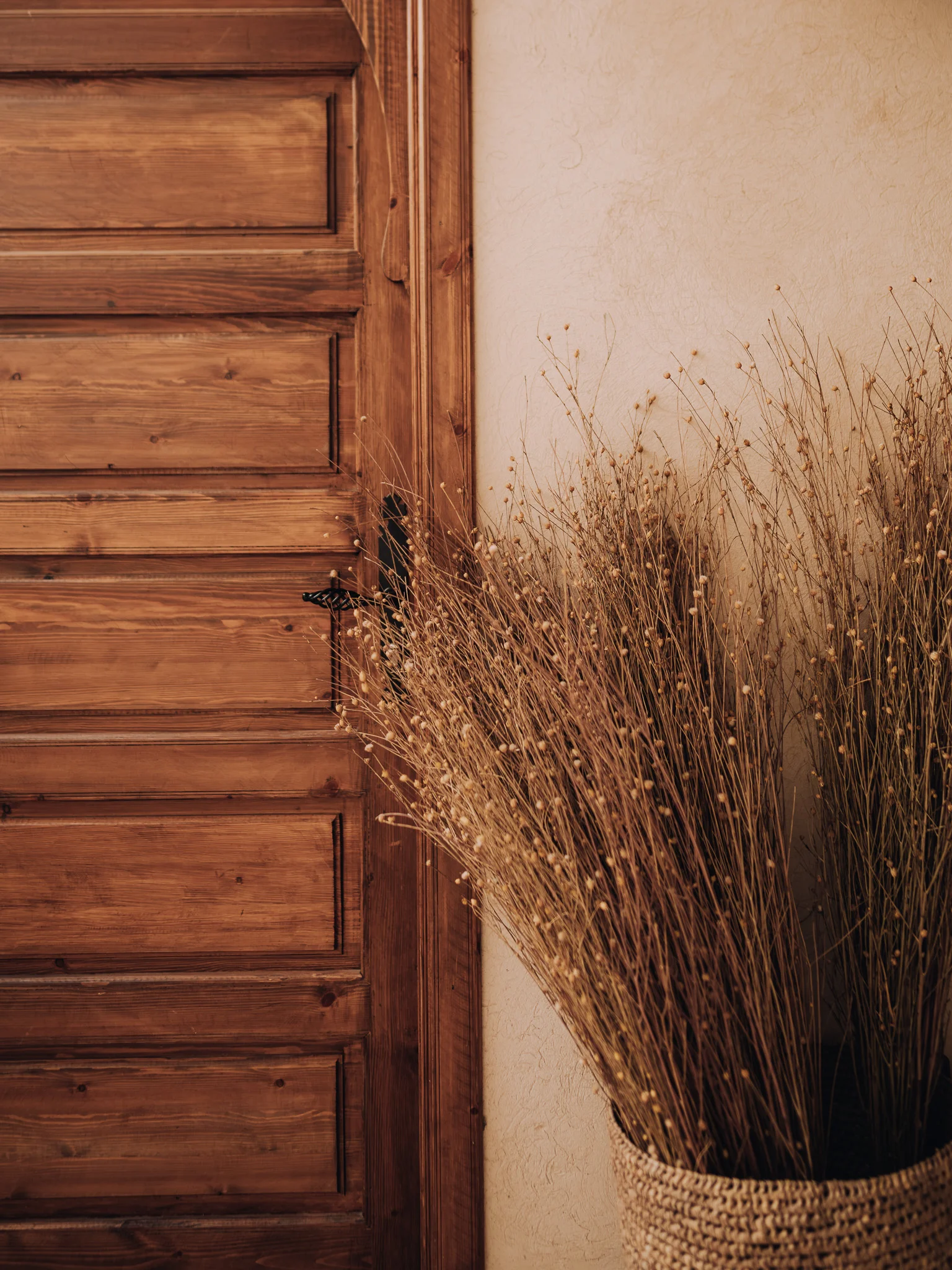 Bedroom entrance with a traditional straw display at Riad Solange in Marrakech.