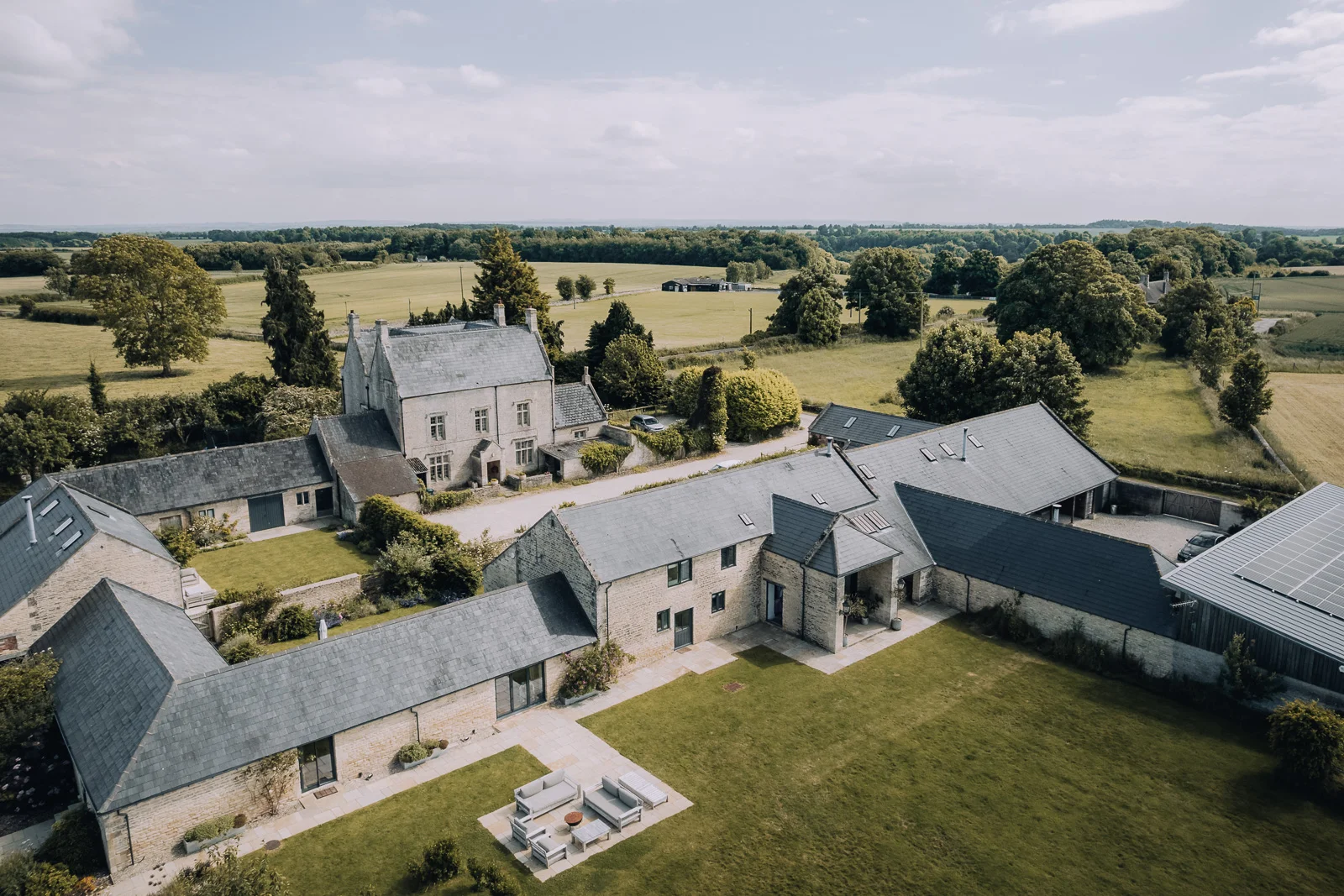 Aerial view of the working farm surrounding Bibury Farm Barns